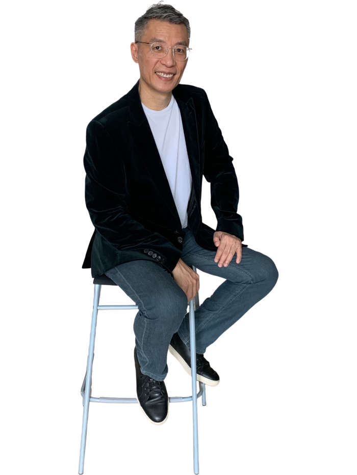 Kirby Poh seated on bar stool