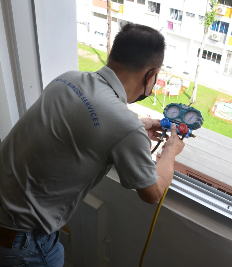 Kirby Poh's air con servicing client checking air con gas pressure