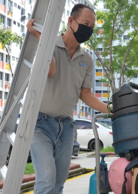 Kirby Poh's air con servicing client preparing for air con cleaning service