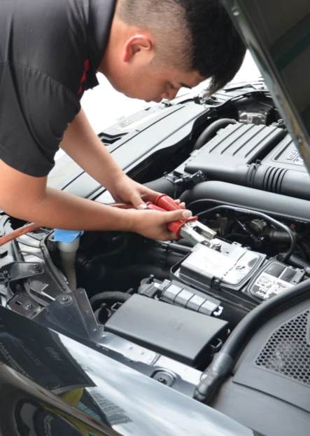 Kirby Poh's car servicing client replacing car battery