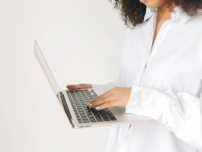 Office worker typing on laptop